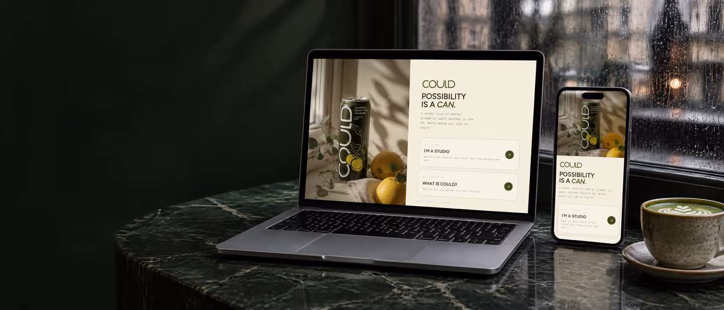 Drink Could's Shopify store, launched by Codersy, on a laptop and phone